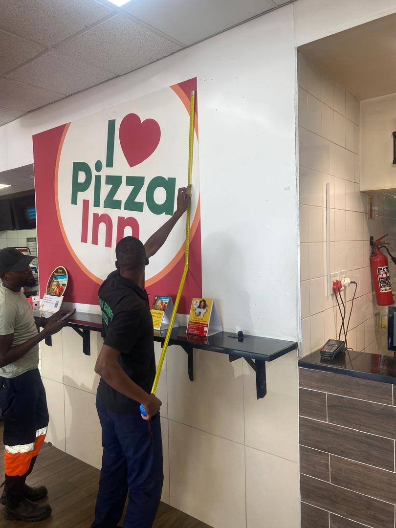 Galley Investment technicians doing site work at Pizza Inn Windhoek